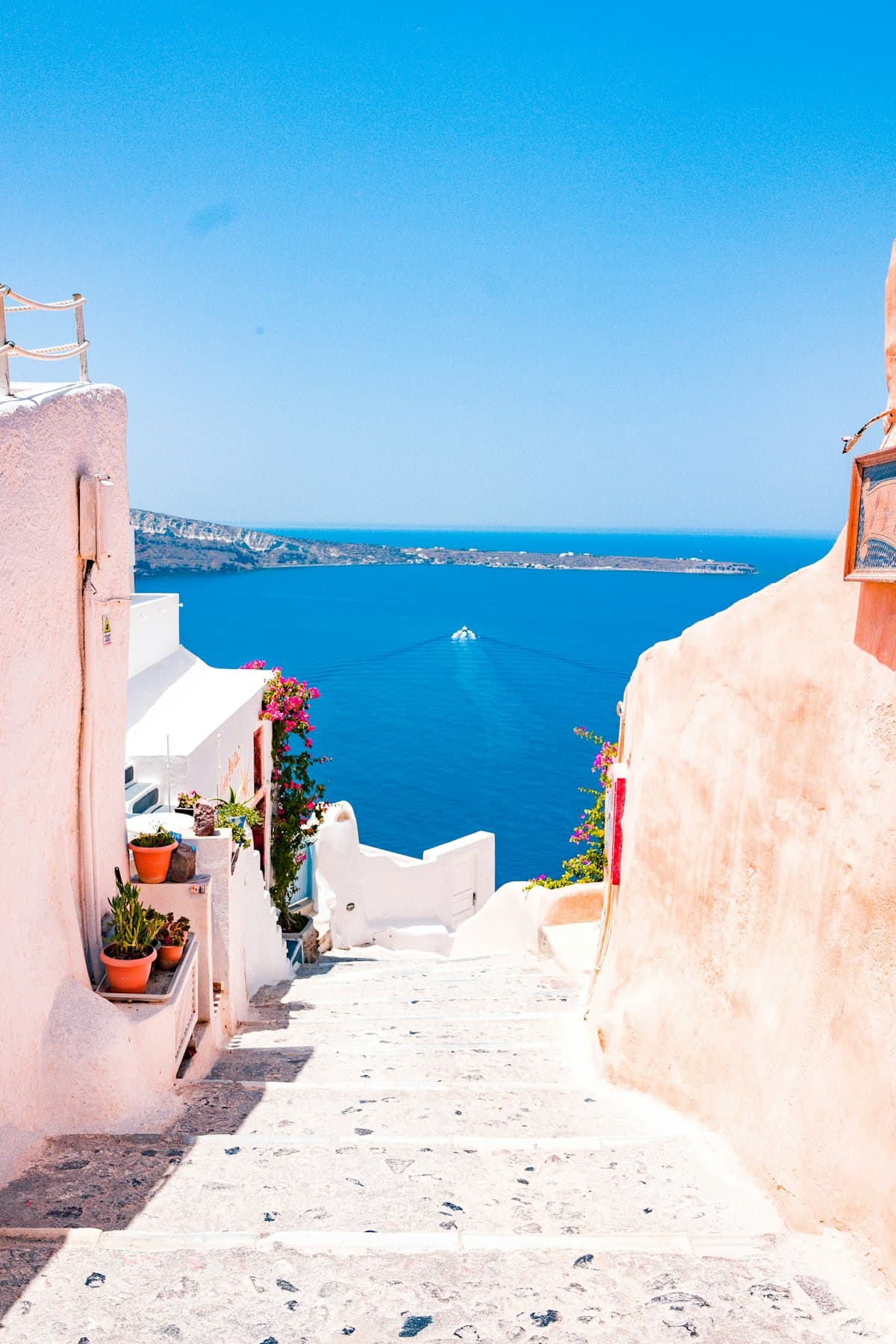 Blue and white domed buildings on Greek island of Santorini overlooking the sea