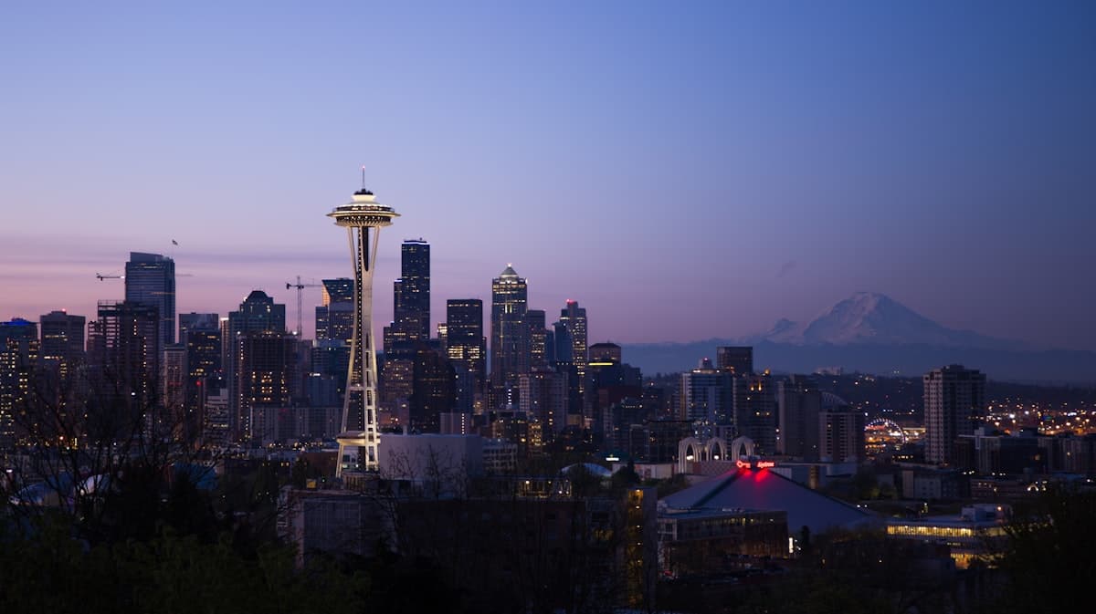 Seattle skyline featuring Space Needle and downtown buildings against puget sound waters