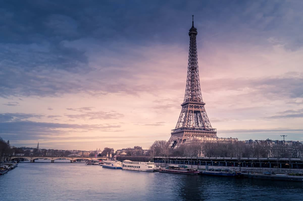 Paris Seine riverbank with historic buildings and trees
